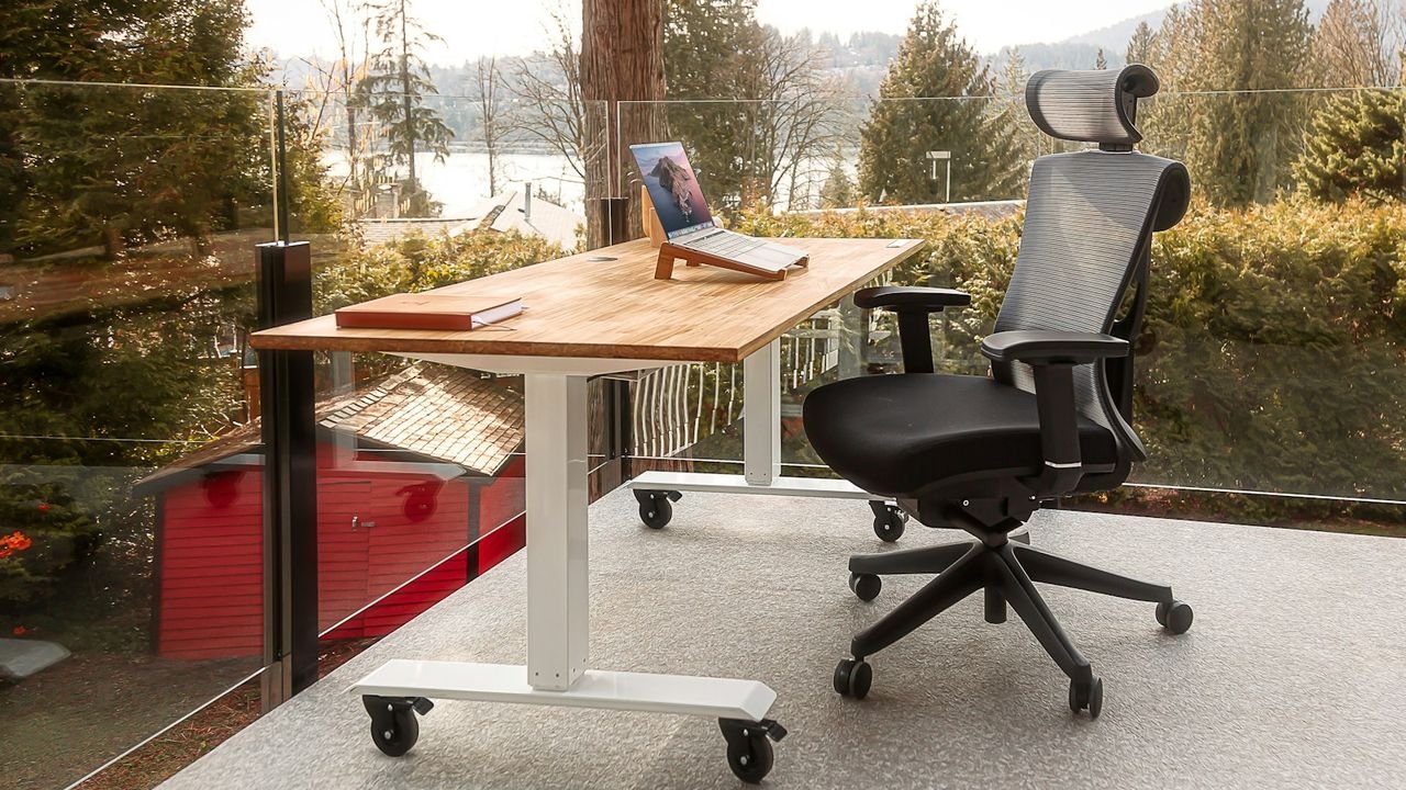 Home office desk with a laptop for a home-based cleaning business