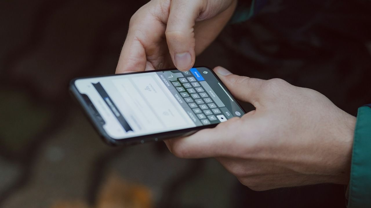 Person typing a follow-up message on a smartphone