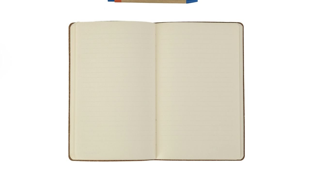 Open notebook and pen for writing website copy