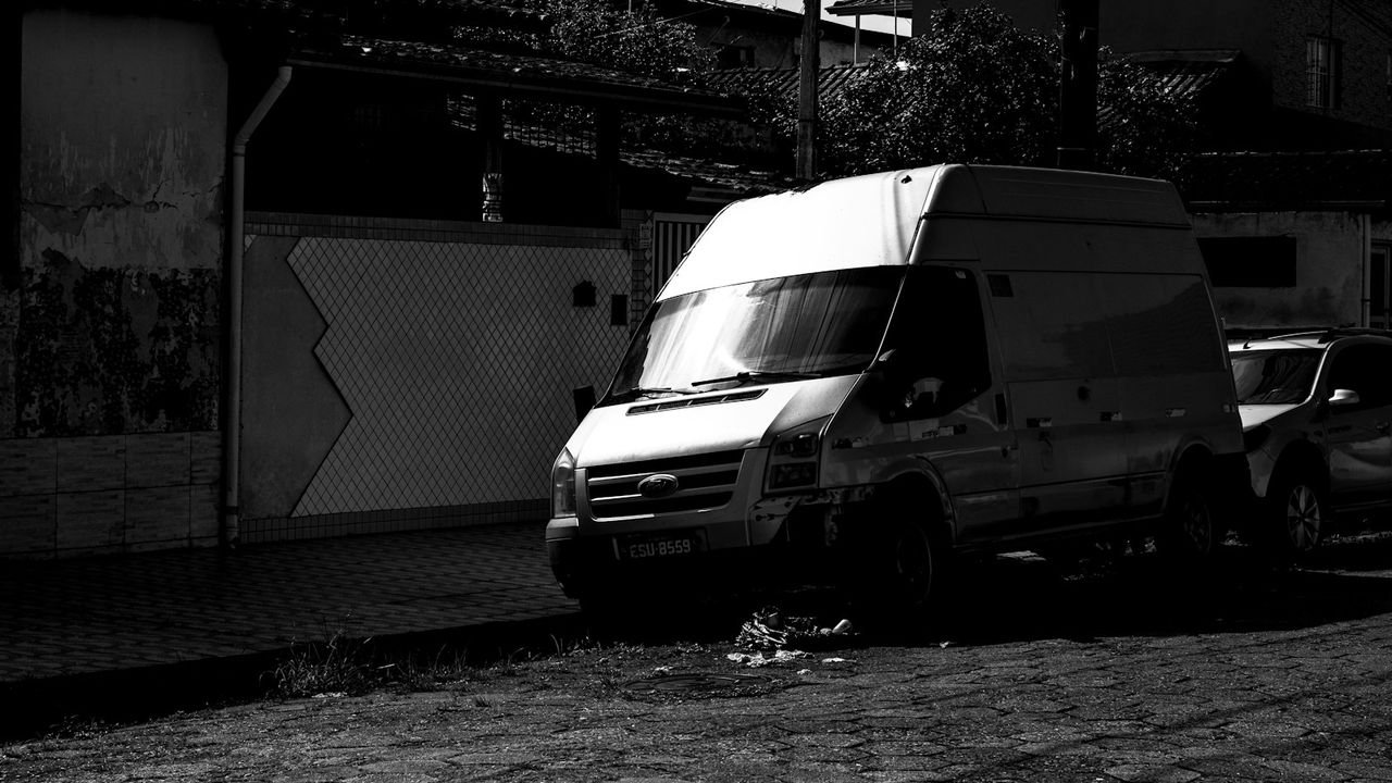 White service van parked on a city street