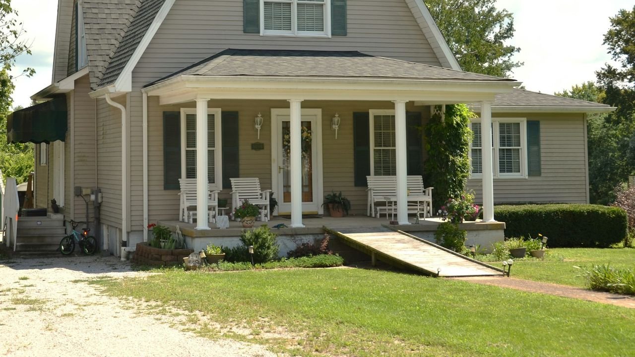House with a front porch in a local neighborhood