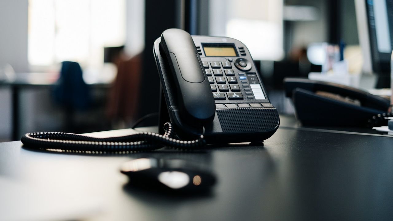 Office desk phone waiting to be answered