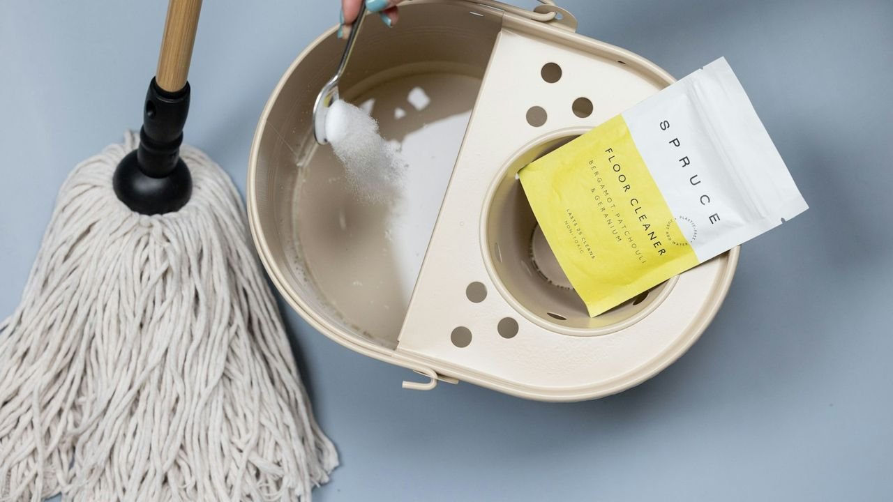Adding cleaning powder to a mop bucket before a regular clean