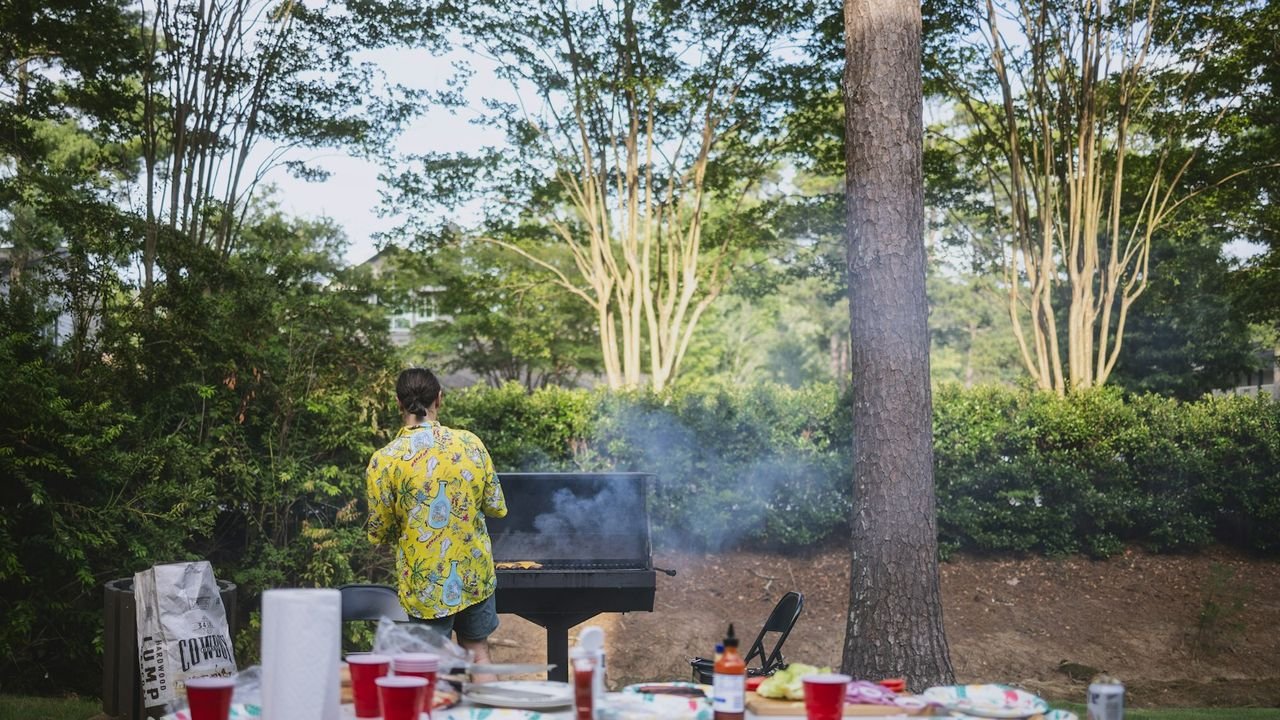 Summer backyard cookout with food and drinks